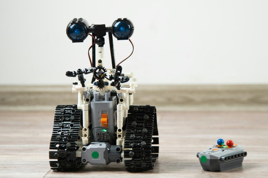 The robot from the children's designer on the control panel. DIY educational toy. A radio-controlled